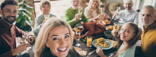 Photo of Big Family Sit Feast Dishes Table Around Roasted Turkey