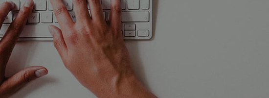 Hands typing on keyboard