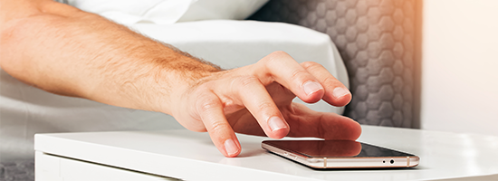 Hand reaching for a phone