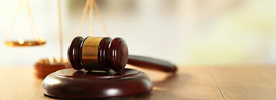 Wooden gavel and scales of justice