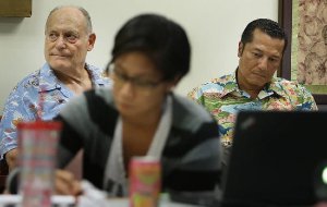 Attorney William Harrison sitting with an elderly client