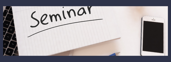Seminar written on a notepad next to a cellphone